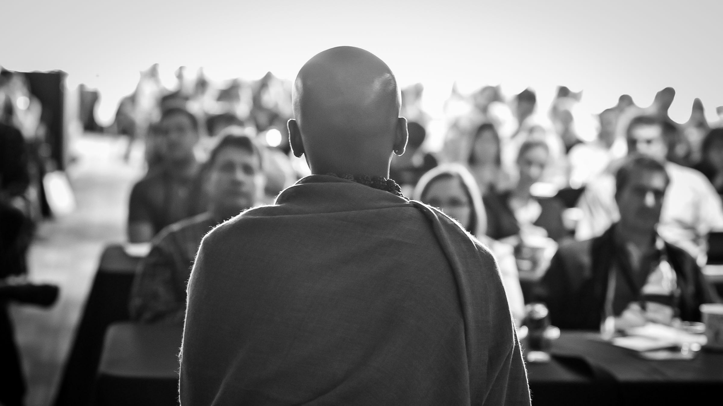 Dandapani seated before an EO audience