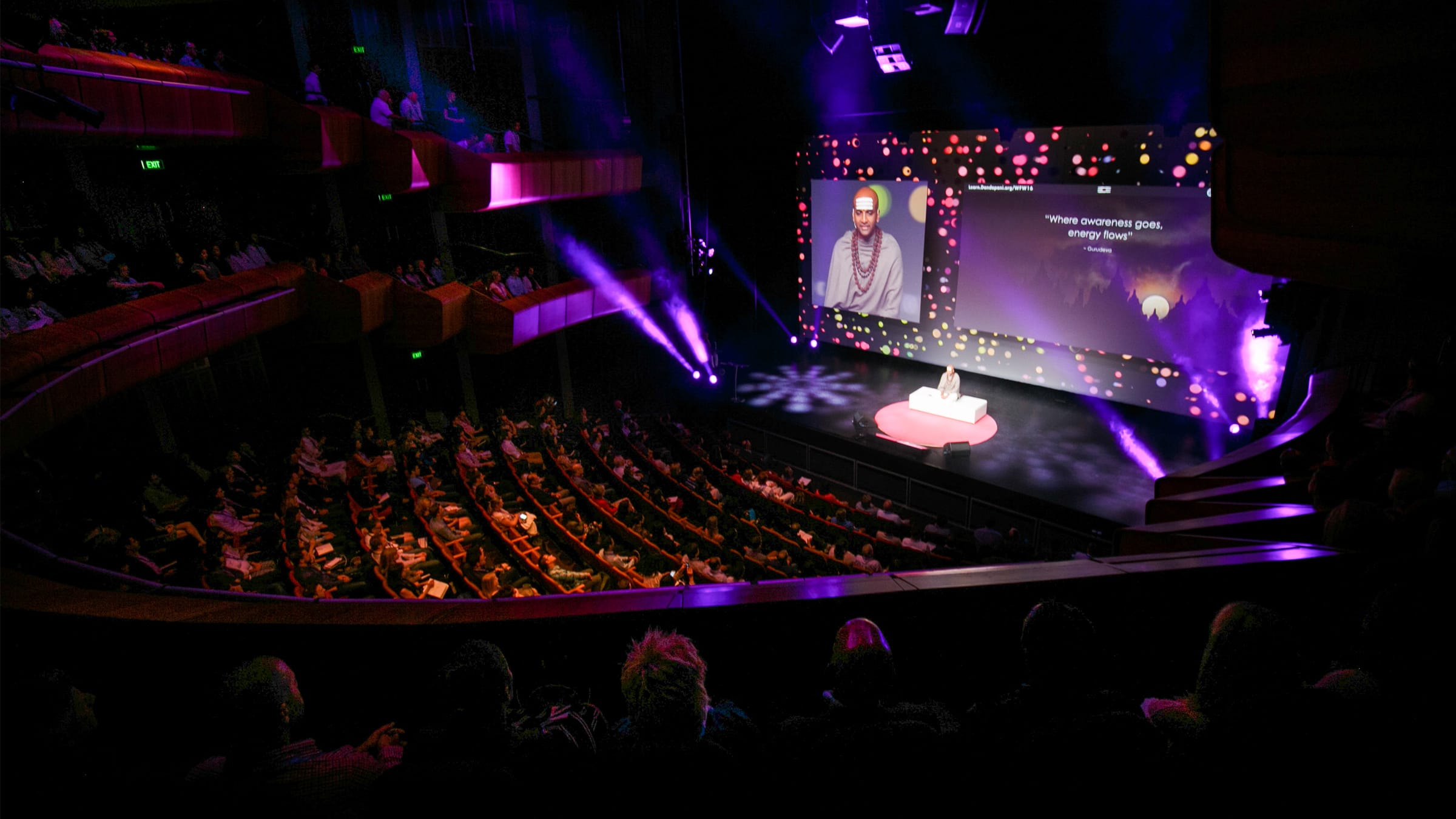 Dandapani delivering a keynote to a packed theater audience as an international speaker