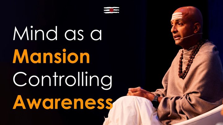 Dandapani speaking on stage beside the title Mind as a Mansion, Controlling Awareness.
