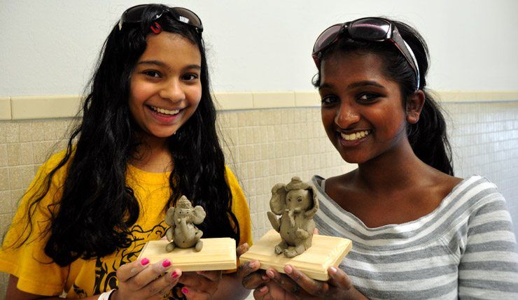 Making clay Ganeshas