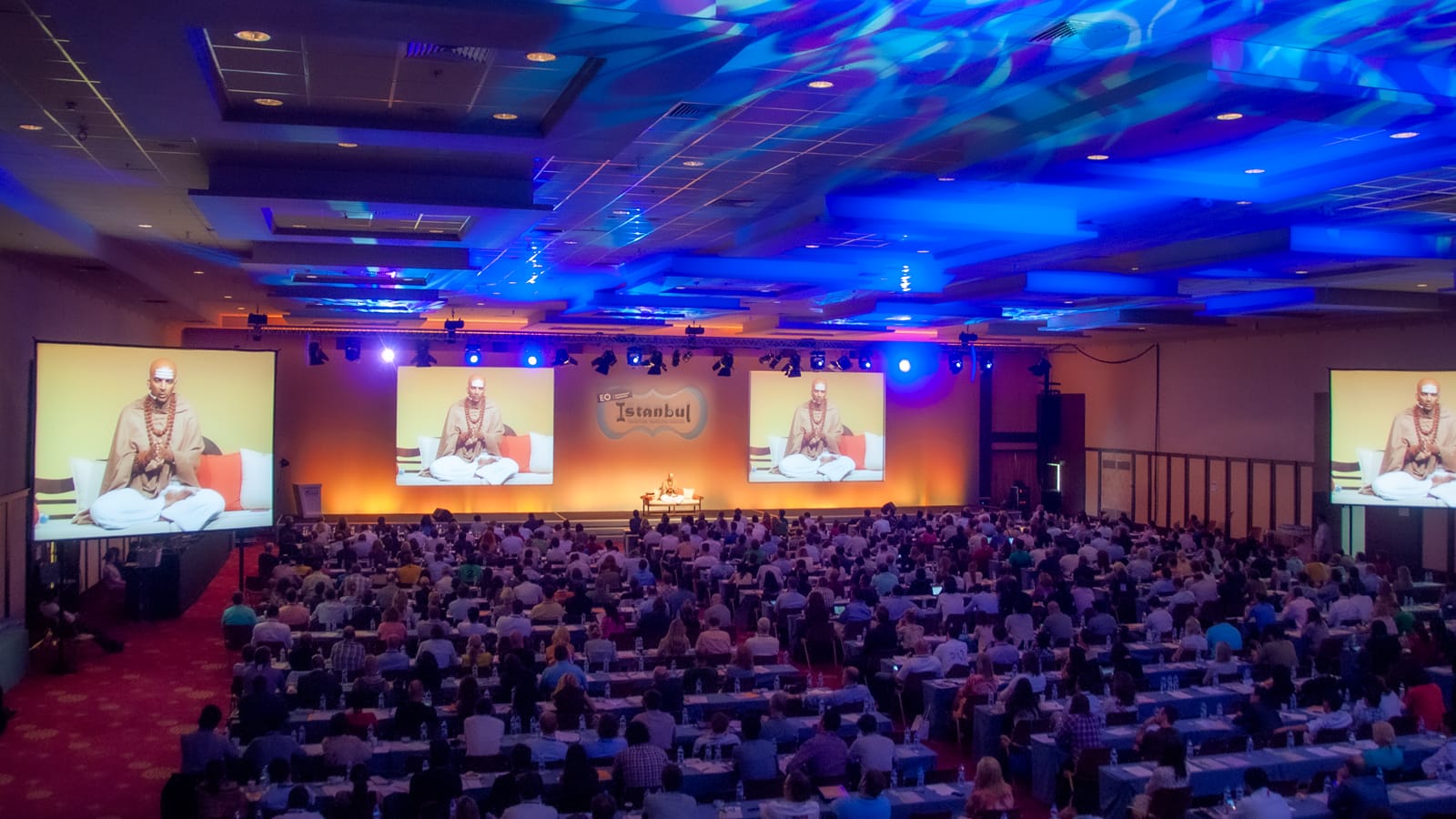 Dandapani delivering a keynote on stage in Istanbul, Turkey