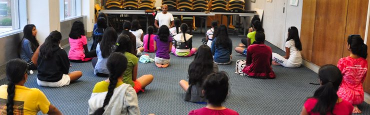 Dandapani teaching youth yoga and meditation