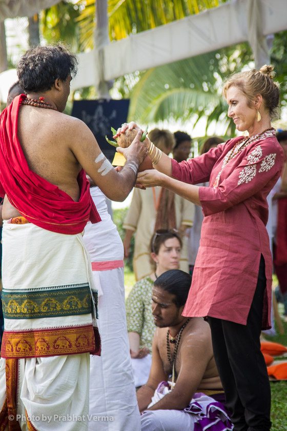 Each participant offers their kumbha (pot) to be placed by the sacred fire for blessings.