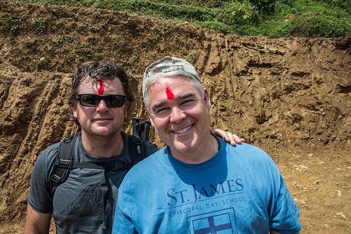Tim (from Australia) and John O (from New Orleans) both part of YPO, get blessed with a bindi (red powder) as they come down the mountain. 