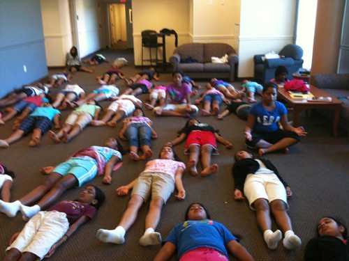 Savasana or the corpse pose if the favorite among the kids as you can image at this time in the morning.