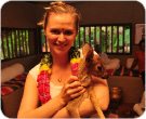 Tatiana holds a baby deer at the Anandham Swamimalai resort