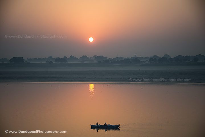 The sun rises over the Ganges. 