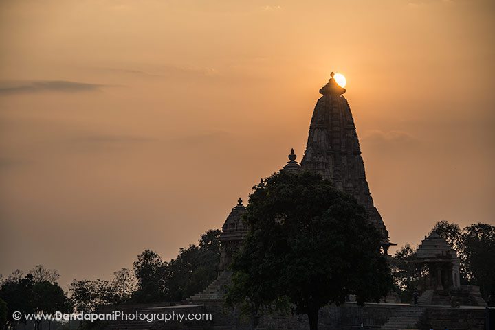 The sun sets over one of the temple towers.