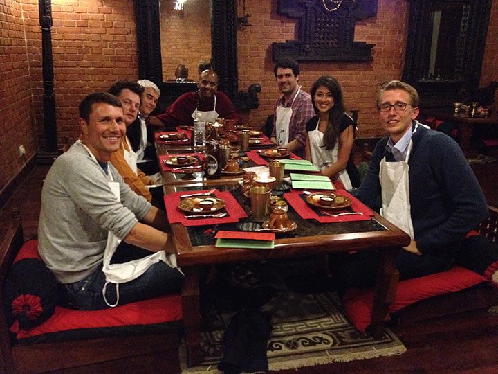 Enjoying a traditional Nepalese dinner