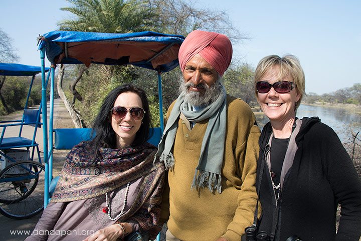 Sarah and Robin pose with their charismatic rickshaw driver