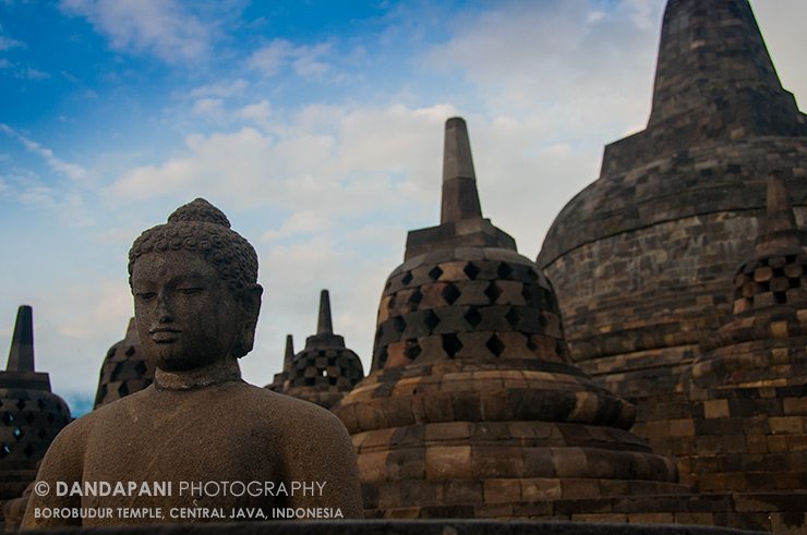 One of the many smaller domes on the temple has been destroyed revealing a meditating Buddha
