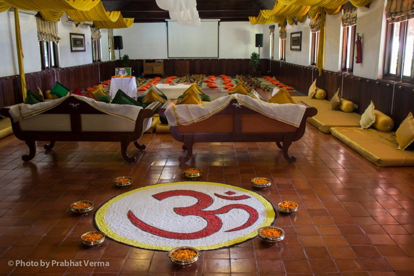 The venue for our afternoon classes is beautifully set up with a colorful OM kollam (mandala) made of rice flour gracing the entrance.