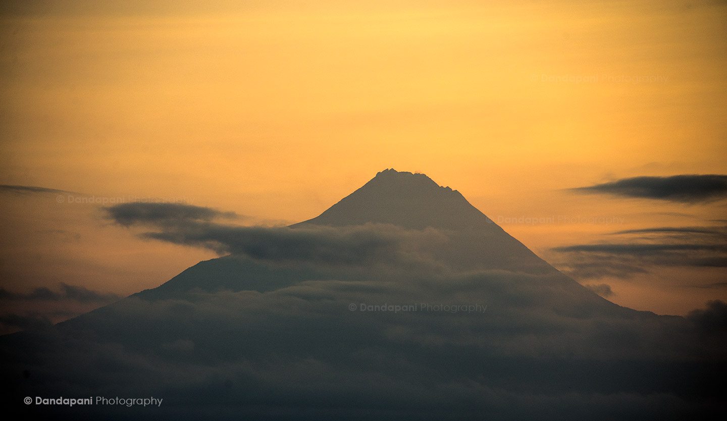 The sunrises behind the mighty Gunung Merapi. Still very active this volcano caused massive destruction in 2010.