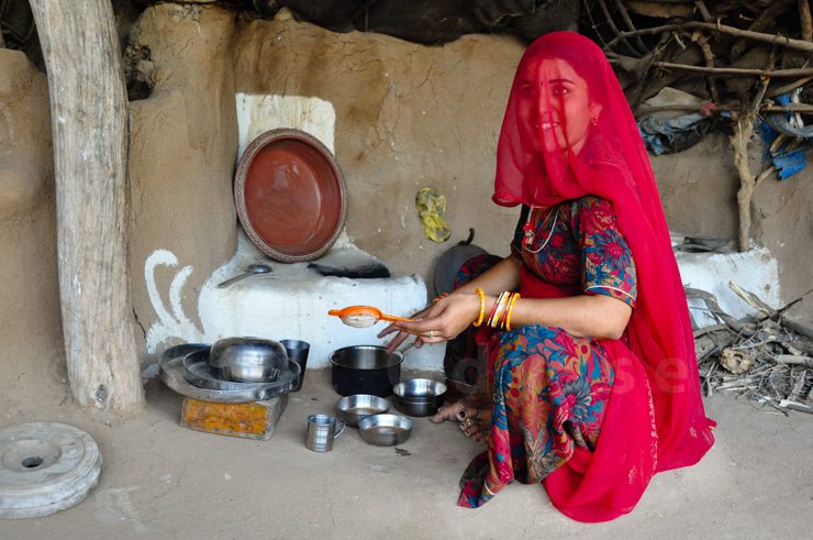 Rajasthani lady makes tea for her guests in Luni, Rajasthan