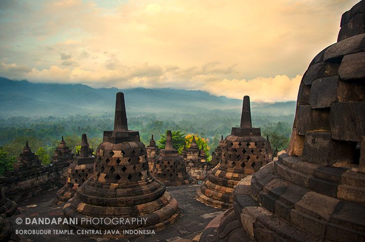 Sun rises revealing the beautiful landscape that surrounds Borobudur temple