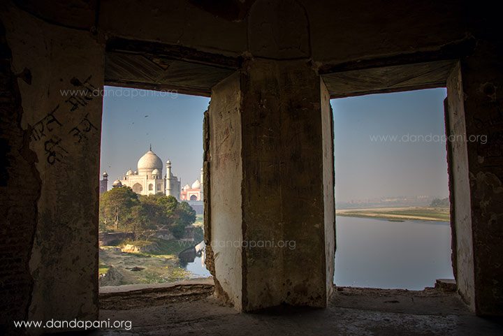 Looking at the Taj Mahal and the Yamuna river through some ruins further down river.